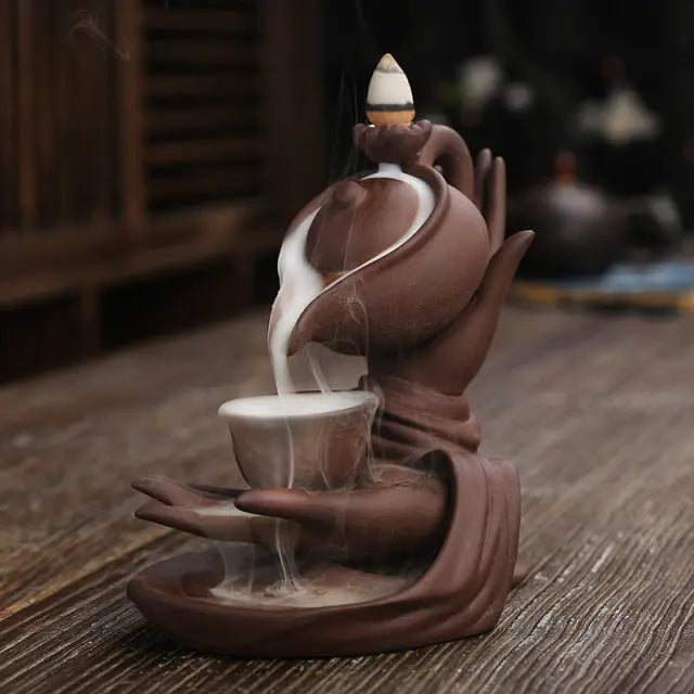 https://yeechop.com/products/ceramic-waterfall-incense-burner-buddha-hand-censer-holder?_pos=1&_sid=3bf4e49d9&_ss=r