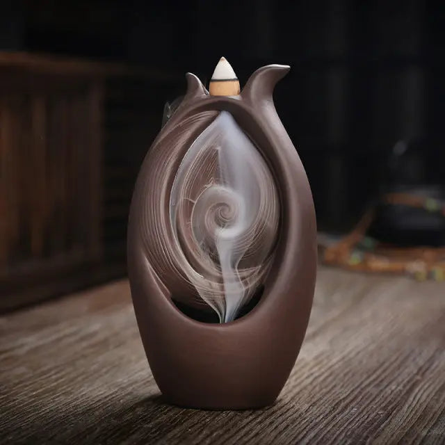 https://yeechop.com/products/ceramic-waterfall-incense-burner-buddha-hand-censer-holder?_pos=1&_sid=3bf4e49d9&_ss=r